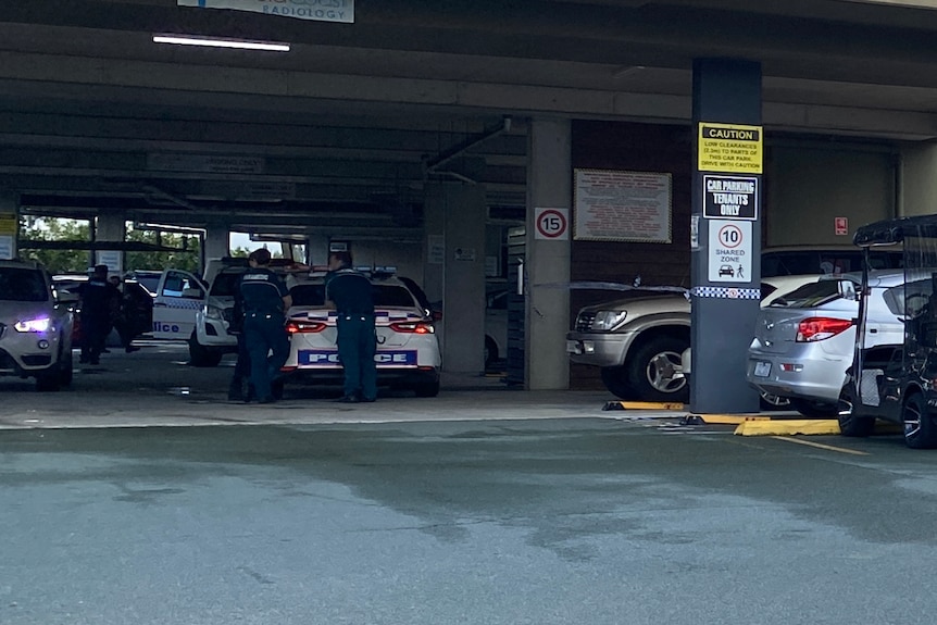 Police cars underneath a shopping centre car park