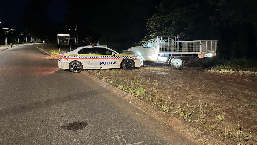 a police car pins a ute on the verge in Kununurra