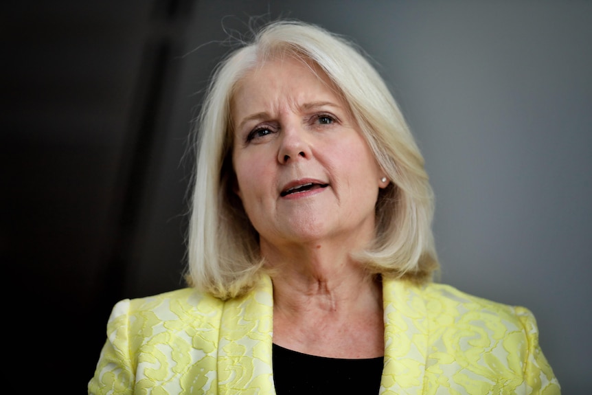 Karen andrews wearing a yellow blazer