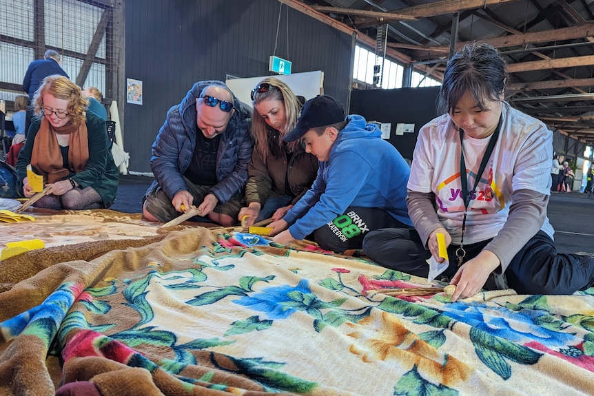 Come Together For Yes attendees undertake a clapstick workshop in the Goods Shed