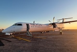 A white Dash 8 aircraft with Nexus written on the side.