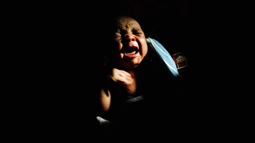 A newborn Kenyan baby, Simaloi, cries shortly after her birth.