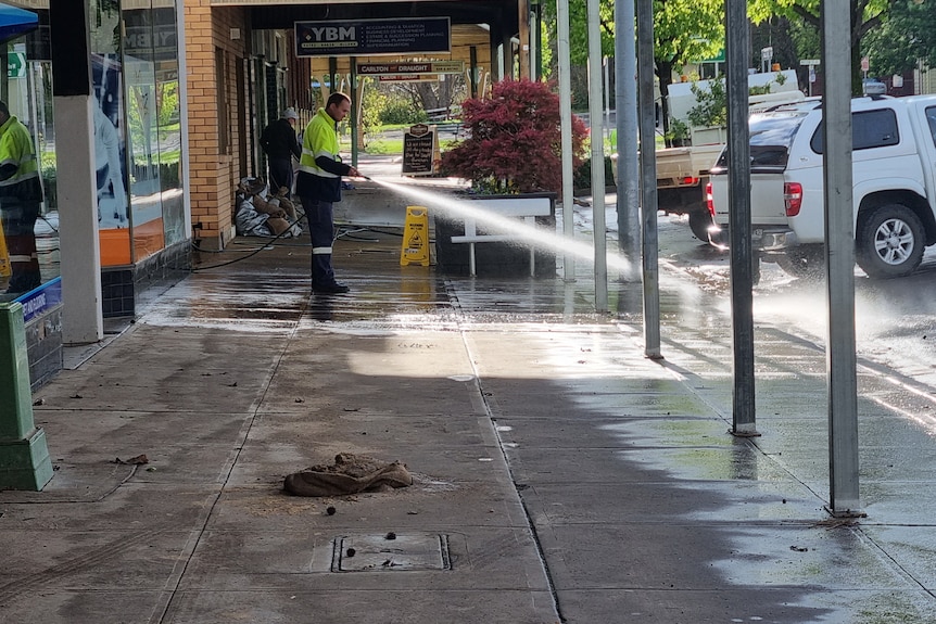 man stands in a main street 