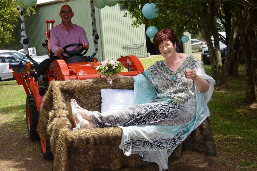 Margie arrives in a tractor on her wedding day.