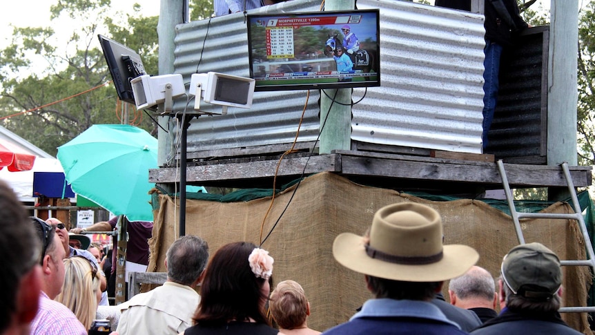 Spectators watch the races from other courses on one of several TV's around the Burrandowan course.