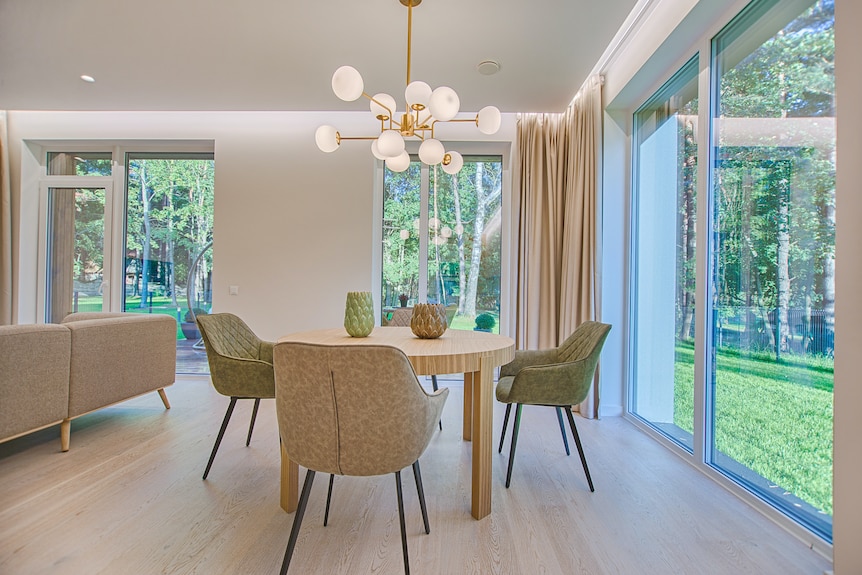 A dining room with big glass windows. 