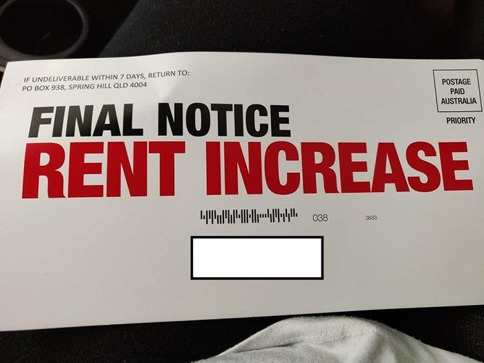 An envelope that reads "final notice, rent increase" in huge red lettering