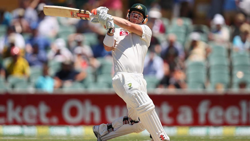 Cop that... David Warner plays a hook shot on his way to his third Test century.