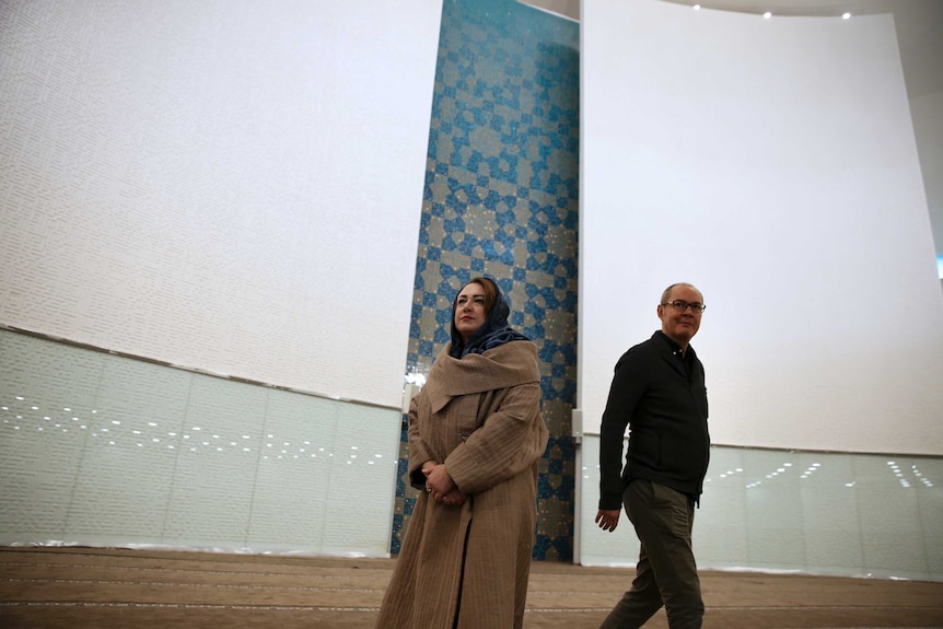 Architechts Catherine Spridonoff and her husband Reza Daneshmir standing in the mosque's prayer hall.