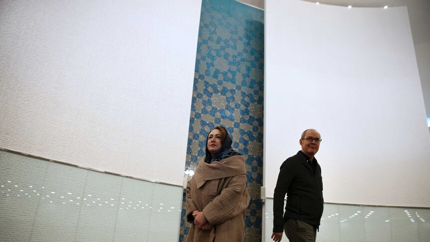 Architechts Catherine Spridonoff and her husband Reza Daneshmir standing in the mosque's prayer hall.