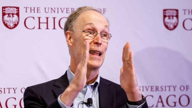 Douglas Diamond gesticulates during an address at the University of Chicago 