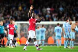Arsenal player Emmanuel Frimpong waves to crowd after League Cup win over Coventry in 2012.