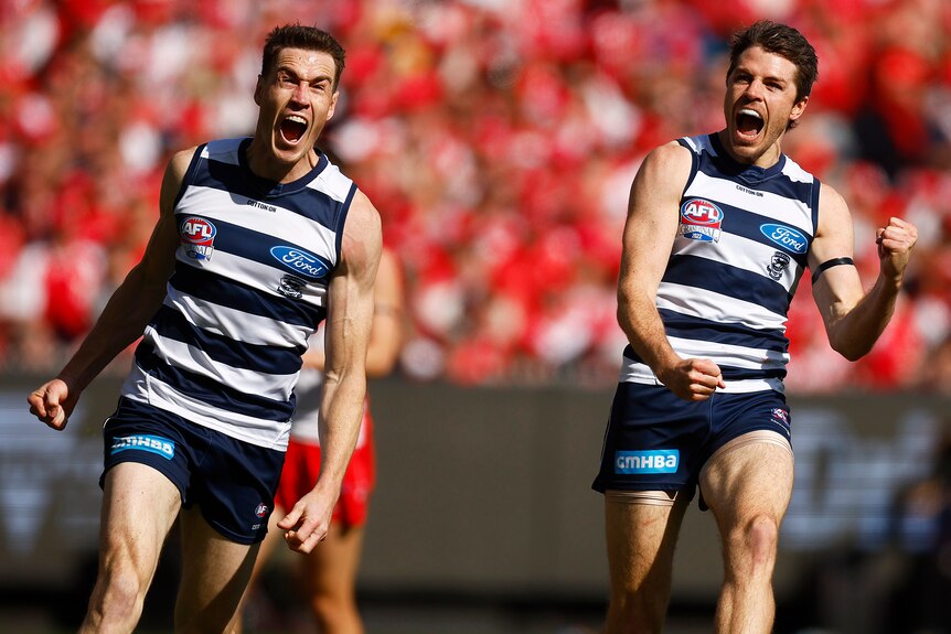 Jeremy Cameron and Isaac Smith celebrate a Geelong goal during the 2022 AFL grand final.