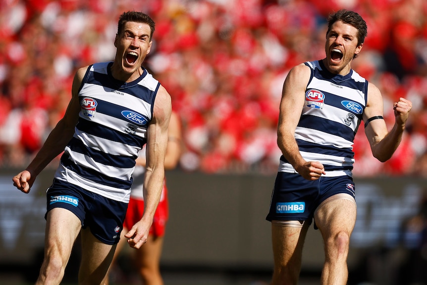 Jeremy Cameron and Isaac Smith celebrate a Geelong goal during the 2022 AFL grand final.