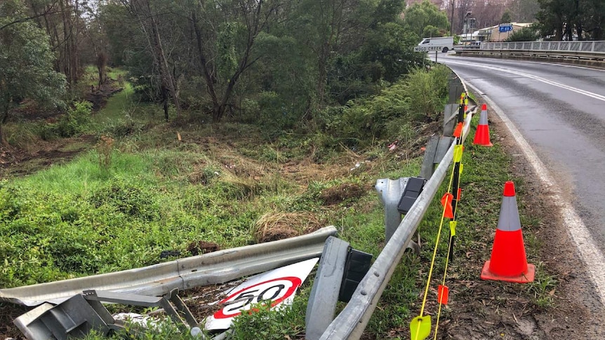 Broken road barrier