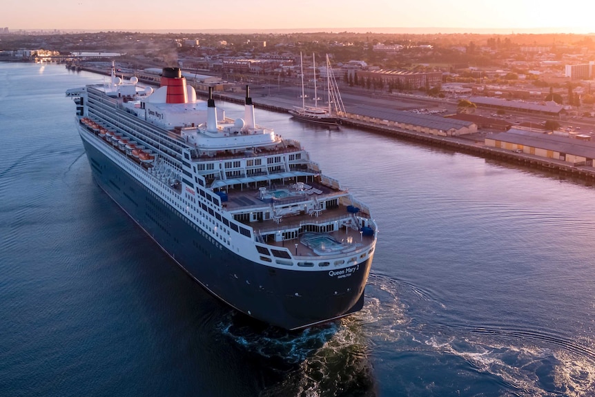 An aerial shot of a cruise ship sailing into Fremantle Port.