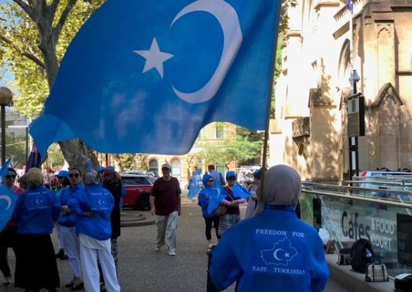 Uyghur woman at protest against China's mass incarceration