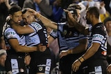 Cronulla Sharks celebrate a try against Parramatta Eels