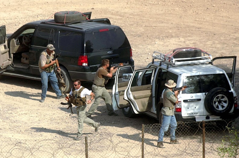 Foreign private security contractors stage a drill in Baghdad