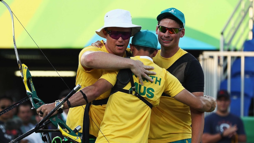 Ryan Tyack, Taylor Worth and Alec Potts of Australia celebrate beating China