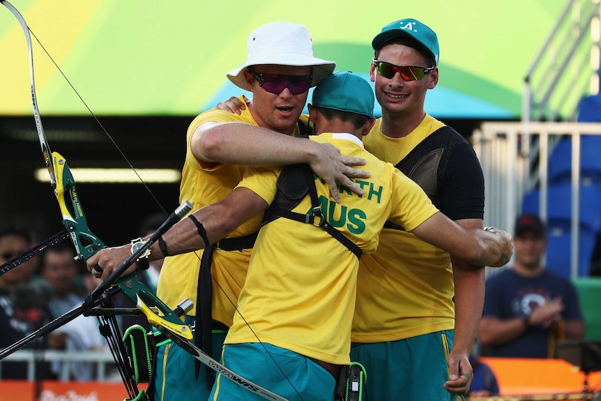 Ryan Tyack, Taylor Worth and Alec Potts of Australia celebrate beating China