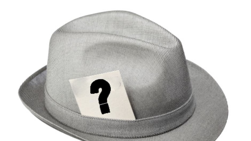 Press hat with question mark note in the band.