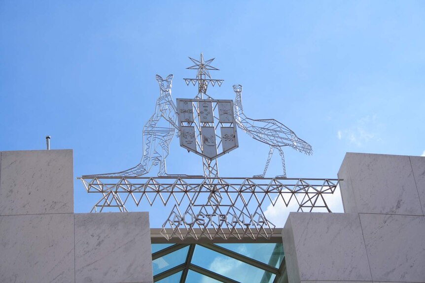 Close up of the coat of arms on Parliament House.