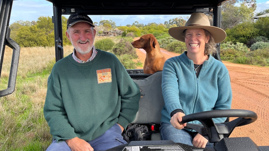 Phil and Fiona Murdoch sit inside the side by side. Their dog sits in the back