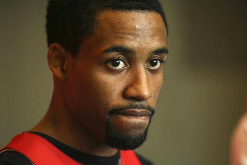 A headshot of Bryce Cotton looking worried.