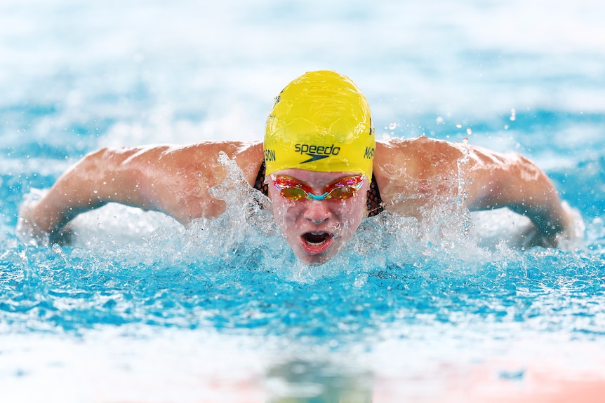 Australian swimmer Lillie McPherson swims butterfly while moving towards the camera.