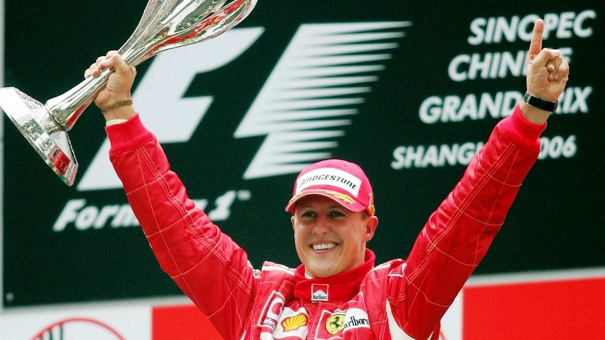 Germany's Michael Schumacher holds the trophy after winning the 2006 Chinese Formula One grand prix.