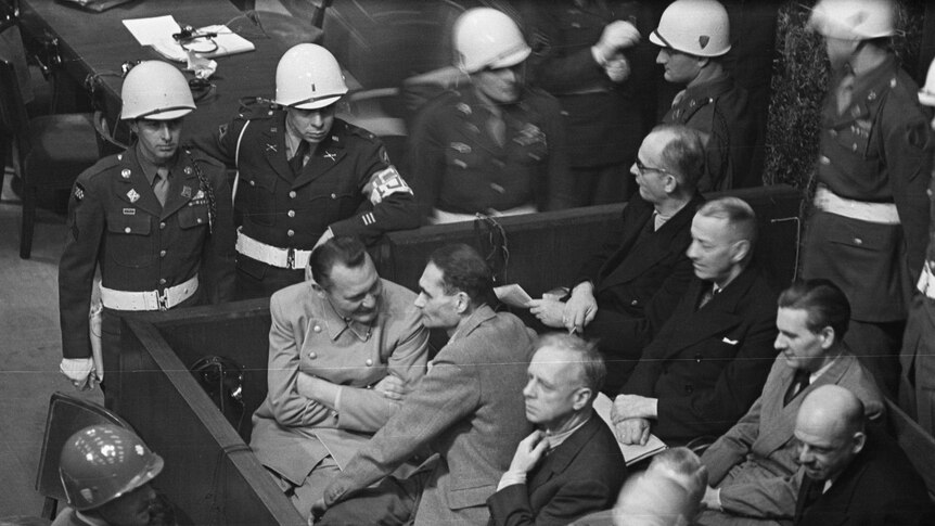 Hermann Göring surrounded by guards at the Nuremburg Trials