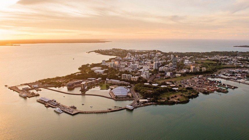 An aerial view of the city of Darwin at sunset.