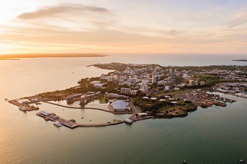 An aerial view of the city of Darwin at sunset.