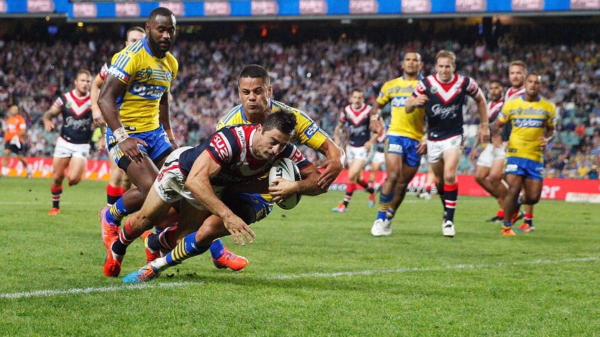 Minichiello dives over to score against the Eels