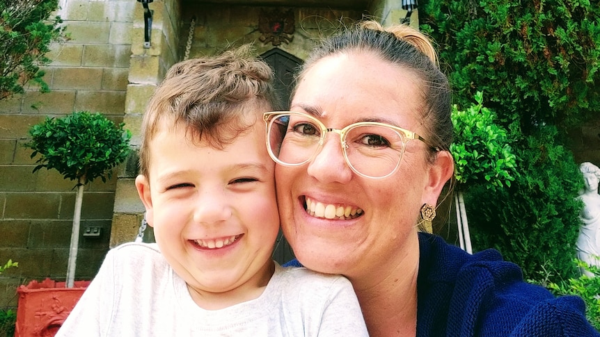 An image of Laura Brown and her son smiling