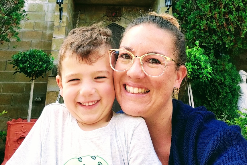 An image of Laura Brown and her son smiling
