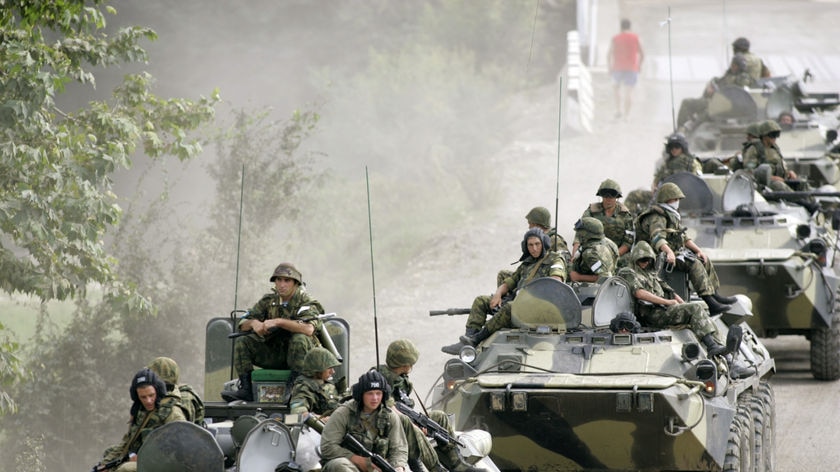 A Russian military convoy travels along a main road leading to the River Enguri