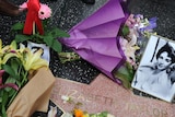 Flowers placed by fans on Elizabeth Taylor's star.
