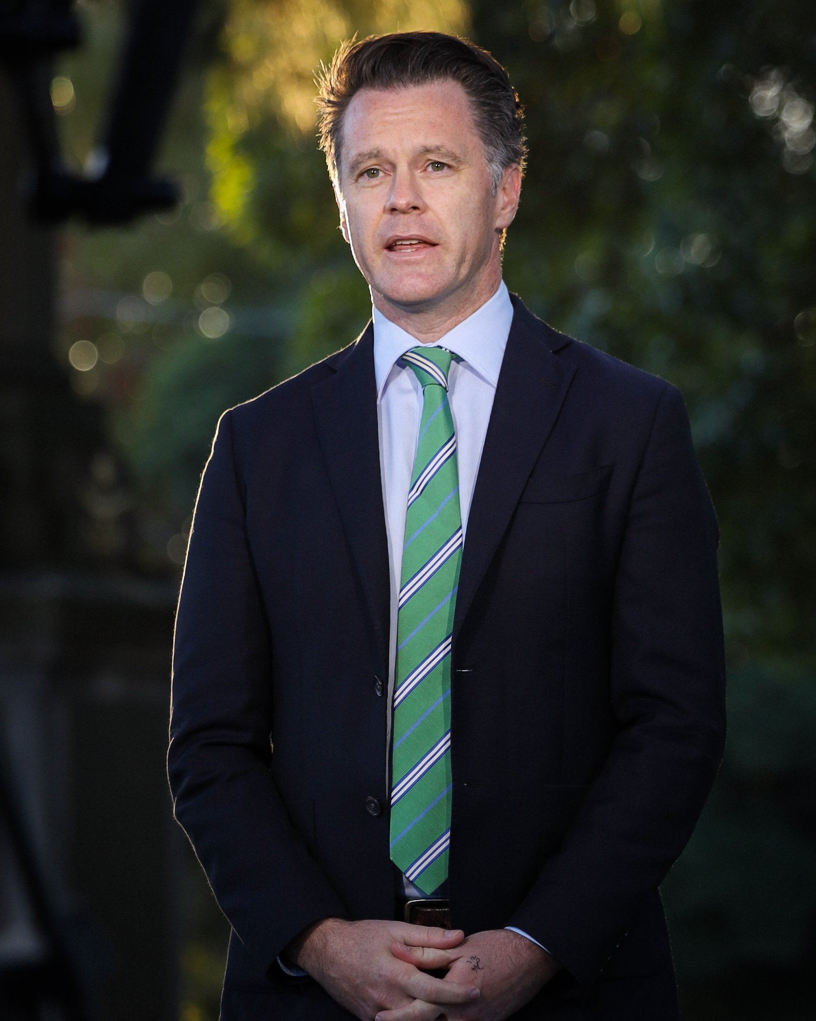 a man standing outside and talking