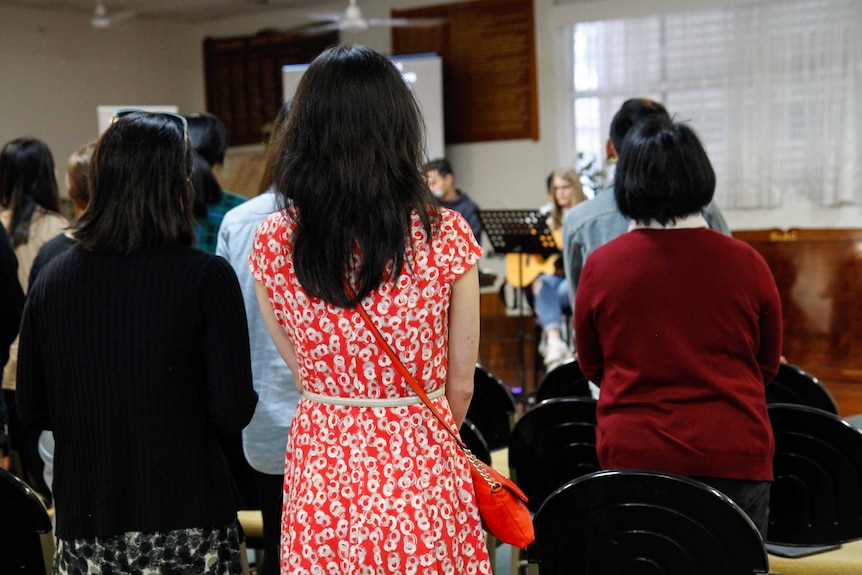 The backs of congregants at Providence Church during a Sunday service.