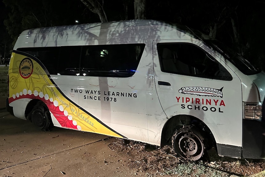 a bus, with its tyres blown out