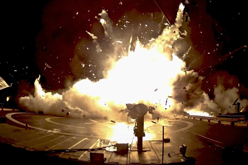 A screengrab shows a major rocket explosion with shrapnel flying everywhere