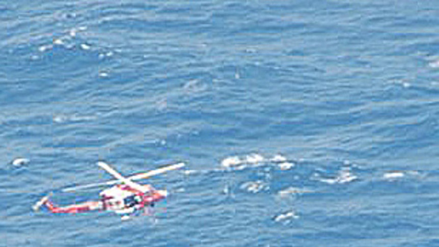 Helicopter rescues catamaran crew