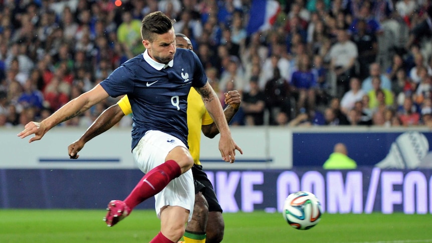 Olivier Giroud scores for France against Jamaica.