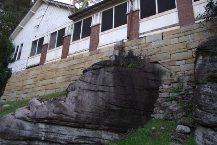 sandstone rocks beneath a house