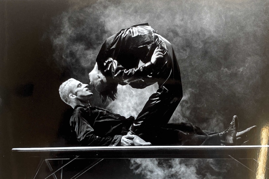 A black and white photograph of two circus performers on stage in Rock n Roll Circus' The Dark