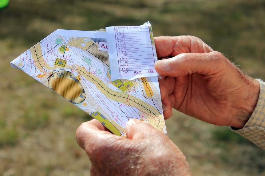 Hands holding a map