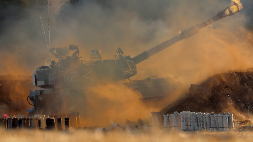 An Israeli artillery unit fires toward