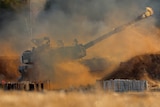 An Israeli artillery unit fires toward